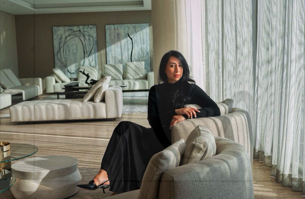The founder of Nahal Home seated in a completed residential interior